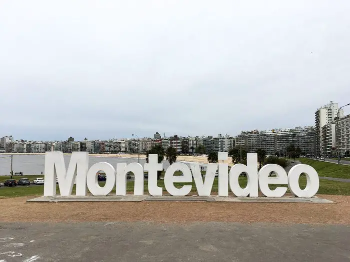 Sign written Montevideo with city skyline on the foreground