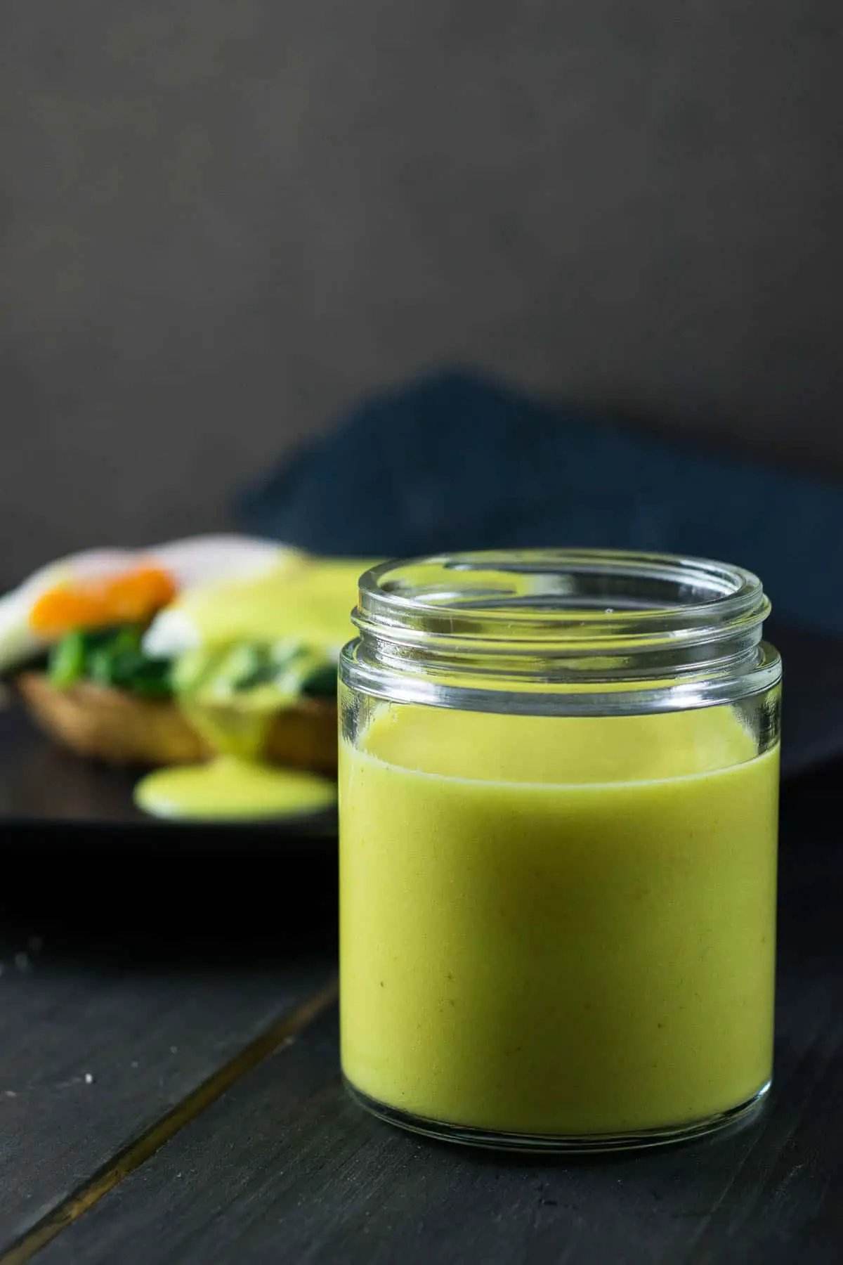 healthy mock hollandaise sauce served in a glass jar