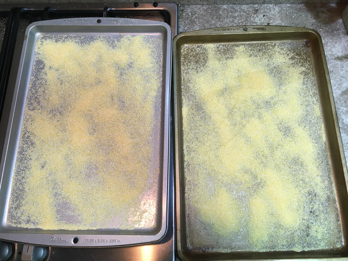 Baking pans dusted with cornmeal