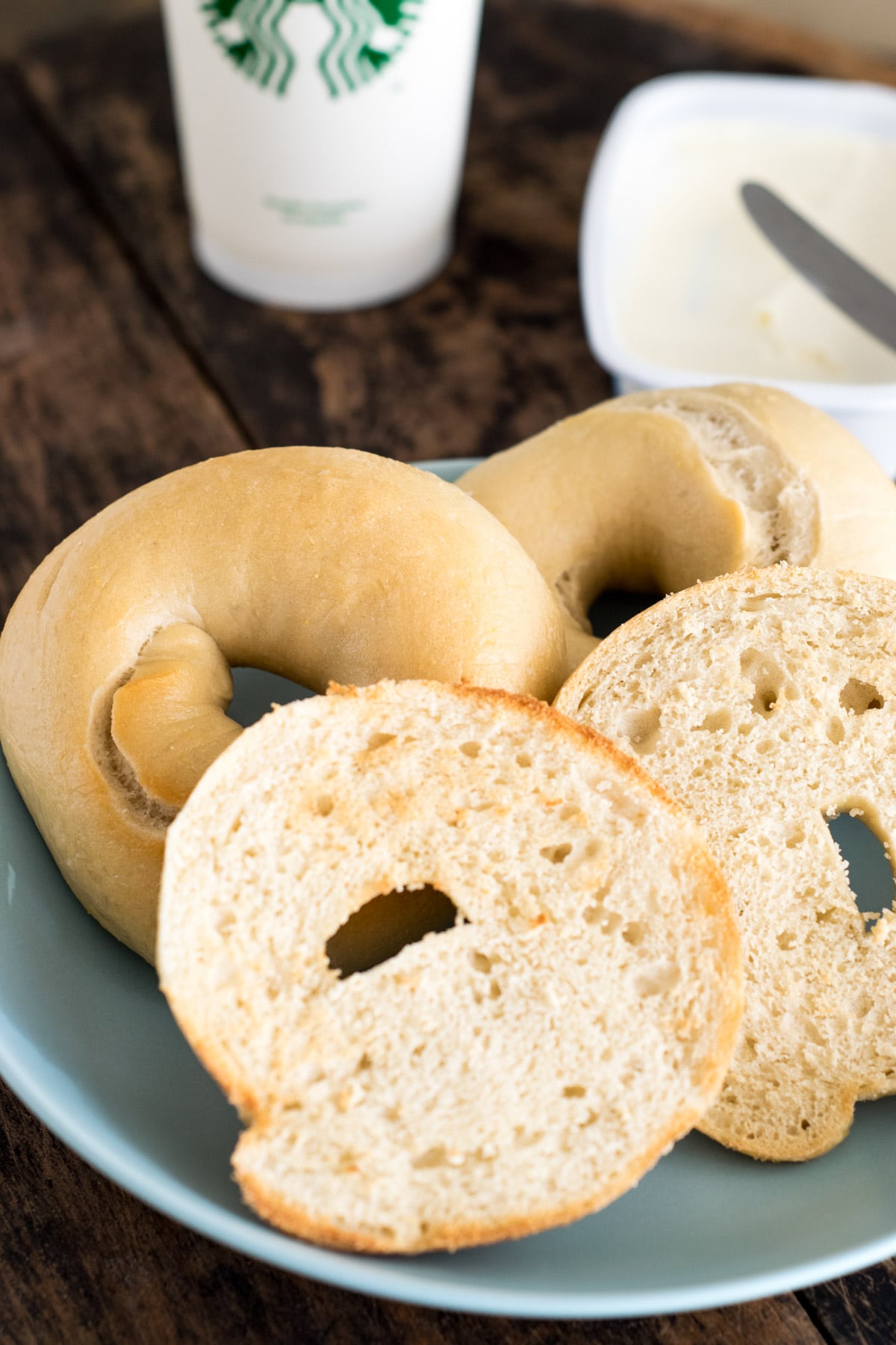 Homemade Bagels - sliced, toasted and placed in a light blue plate 