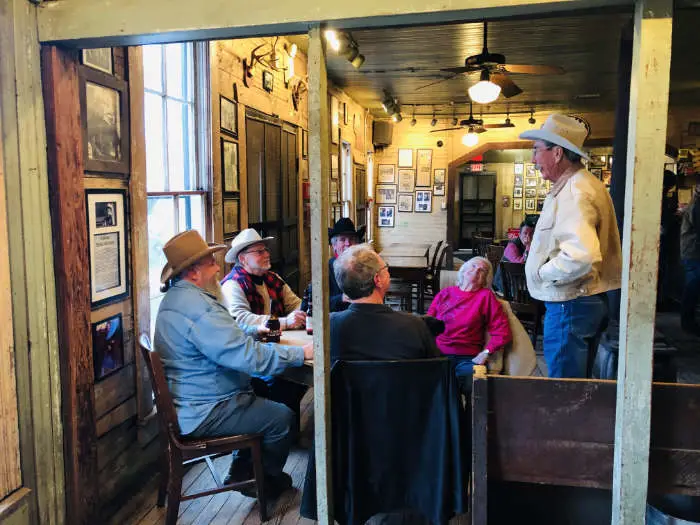 Senior citizens at a table inside Gruene Hall